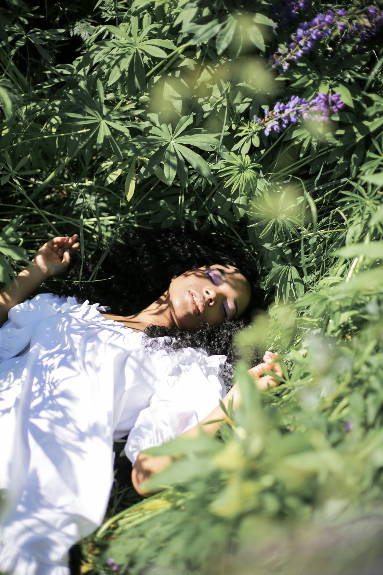 woman laying in the grass