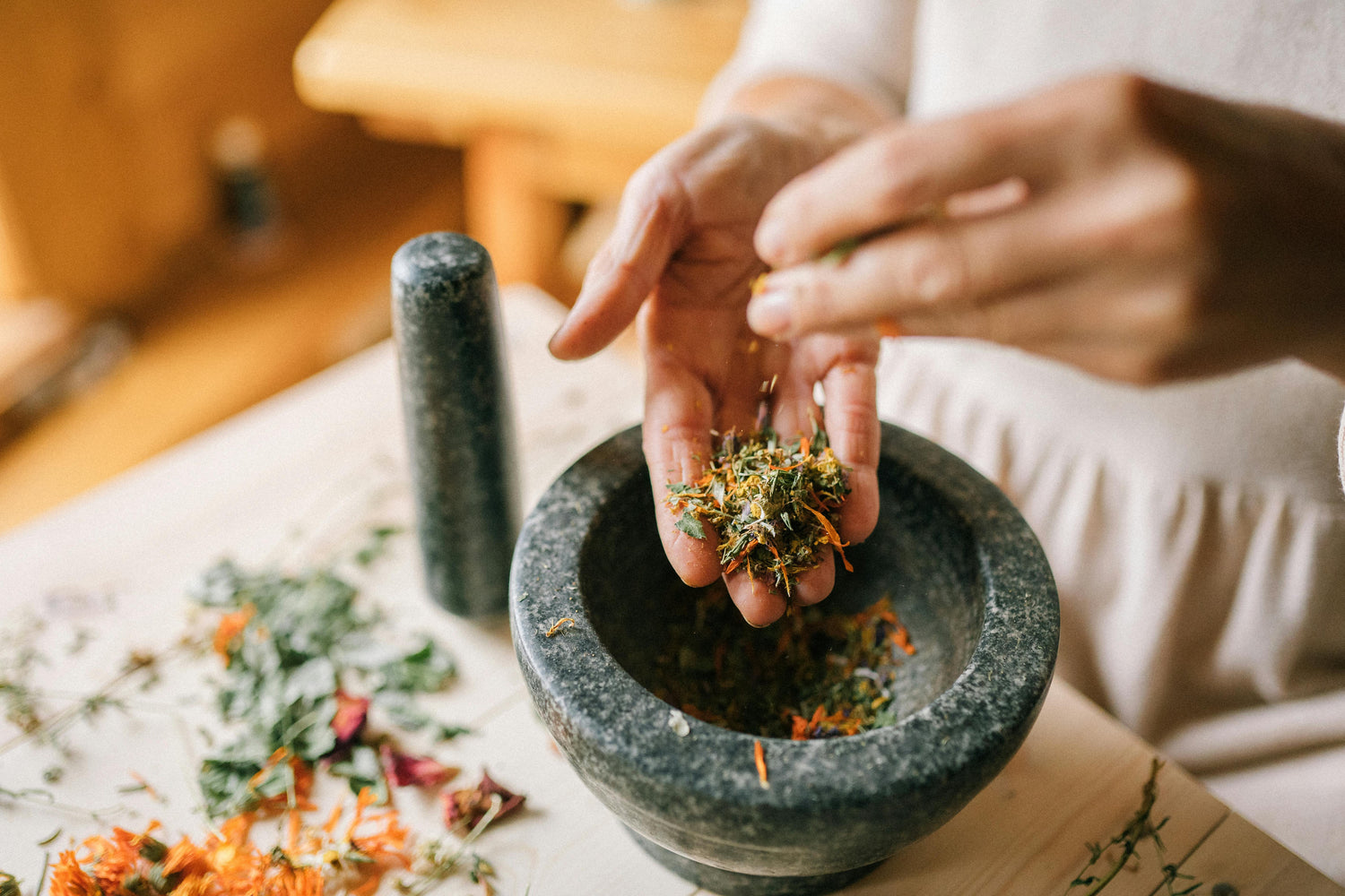 herbalist with herbs in their hand