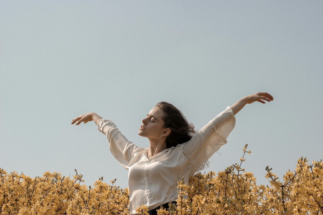woman feeling light and healthy while outdoors